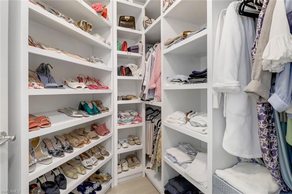 1326 Corso Palermo Court, Unit 3 Naples, FL 34105 - Photo 14 of 33 a view of walk in closet with clothes and shoes