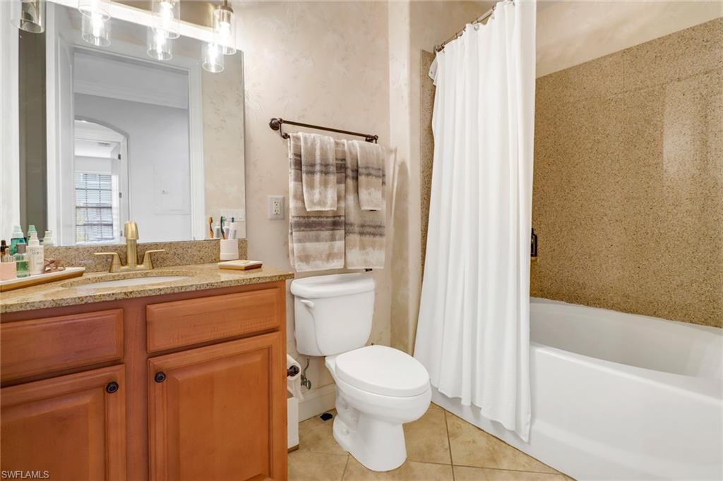 1326 Corso Palermo Court, Unit 3 Naples, FL 34105 - Photo 19 of 33 a bathroom with a sink a toilet and shower