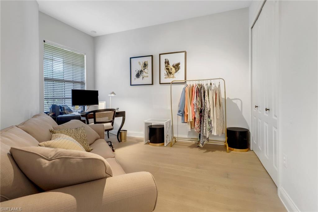 1326 Corso Palermo Court, Unit 3 Naples, FL 34105 - Photo 21 of 33 a living room with furniture and a flat screen tv