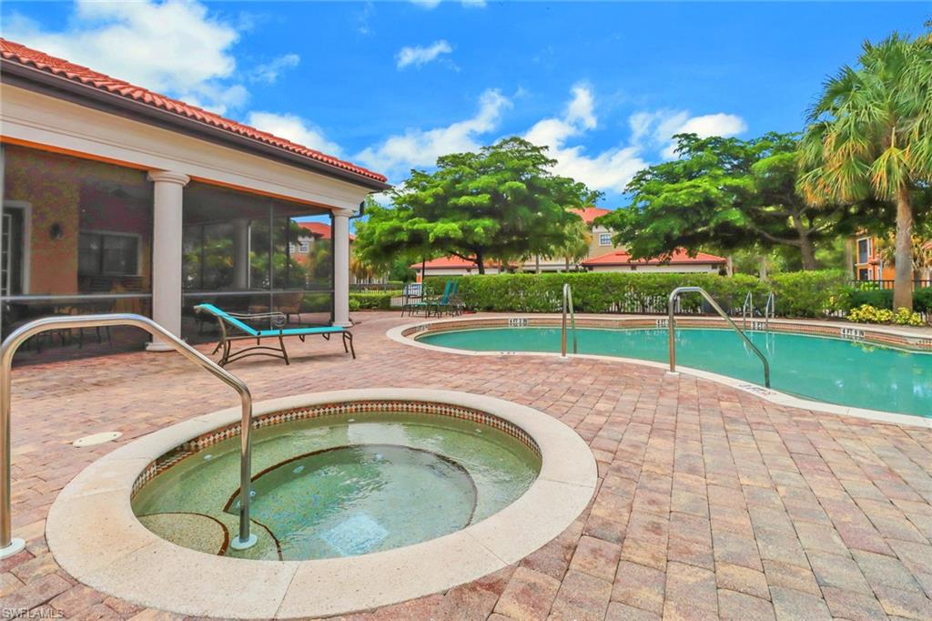 1326 Corso Palermo Court, Unit 3 Naples, FL 34105 - Photo 27 of 33 a swimming pool with outdoor seating and yard