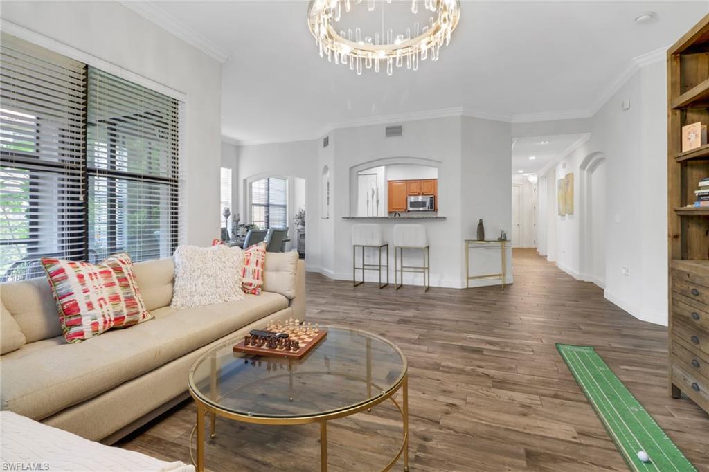 1326 Corso Palermo Court, Unit 3 Naples, FL 34105 - Photo 3 of 33 a living room with furniture and a wooden floor