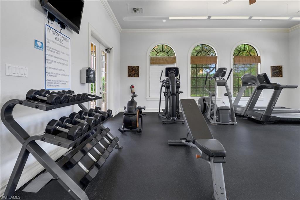 1326 Corso Palermo Court, Unit 3 Naples, FL 34105 - Photo 31 of 33 a room with gym equipment and a large window