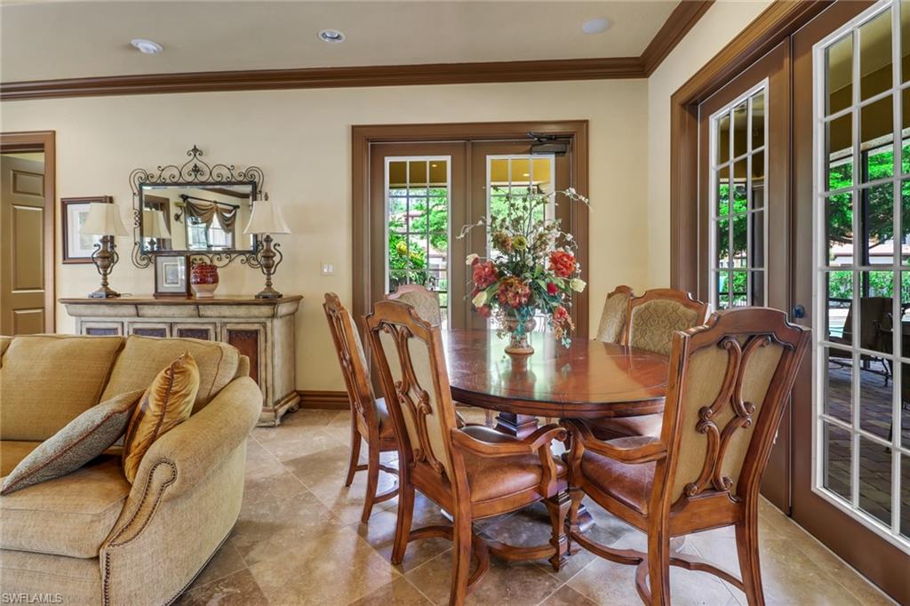 1326 Corso Palermo Court, Unit 3 Naples, FL 34105 - Photo 33 of 33 a view of a dining room with furniture window and outside view