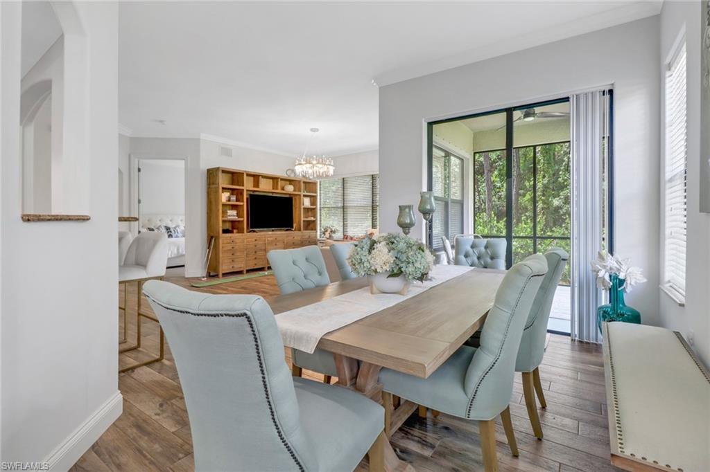 1326 Corso Palermo Court, Unit 3 Naples, FL 34105 - Photo 7 of 33 a view of a dining room with furniture window and outside view
