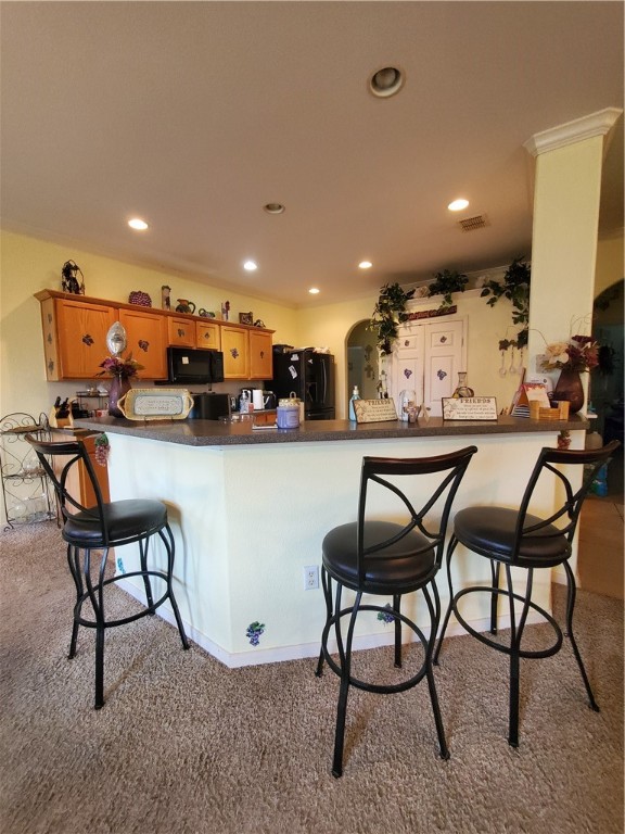 2602 Whirlwind Street Corpus Christi, TX 78414 - Photo 6 of 9 a kitchen with stainless steel appliances kitchen island granite countertop a dining table chairs and a refrigerator