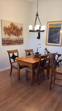a view of a dining room with furniture window and wooden floor