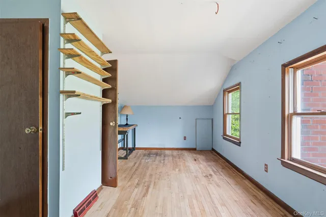 a bedroom with a bed and a chair