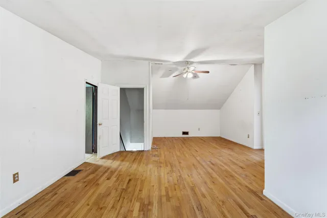 a view of a livingroom with furniture and a workspace