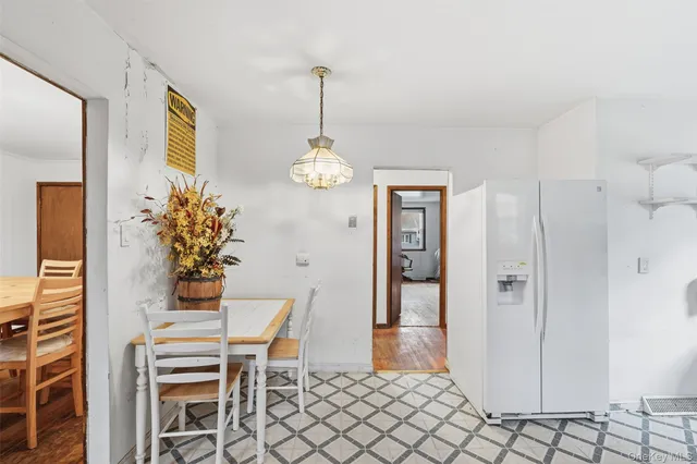 a view of a livingroom with a hardwood floor and a ceiling fan