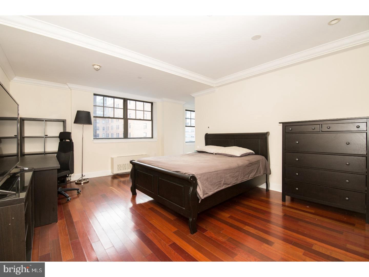 1701 Locust Street, Unit 1517 Philadelphia, PA 19103 - Photo 4 of 16 a bedroom with a bed and with furniture