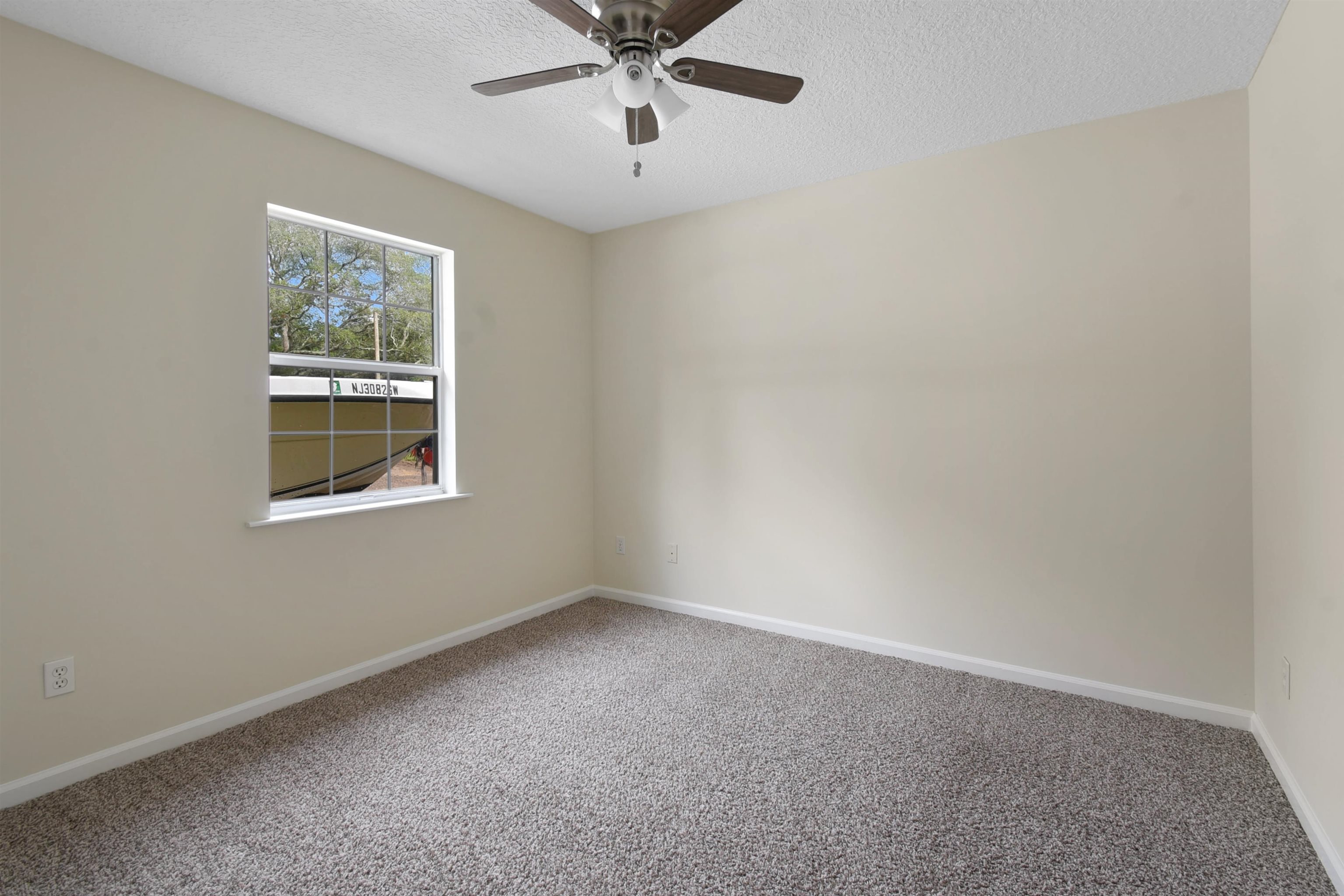 131 Osprey Road St. Augustine, FL 32086 - Photo 28 of 50 a view of an empty room with a window
