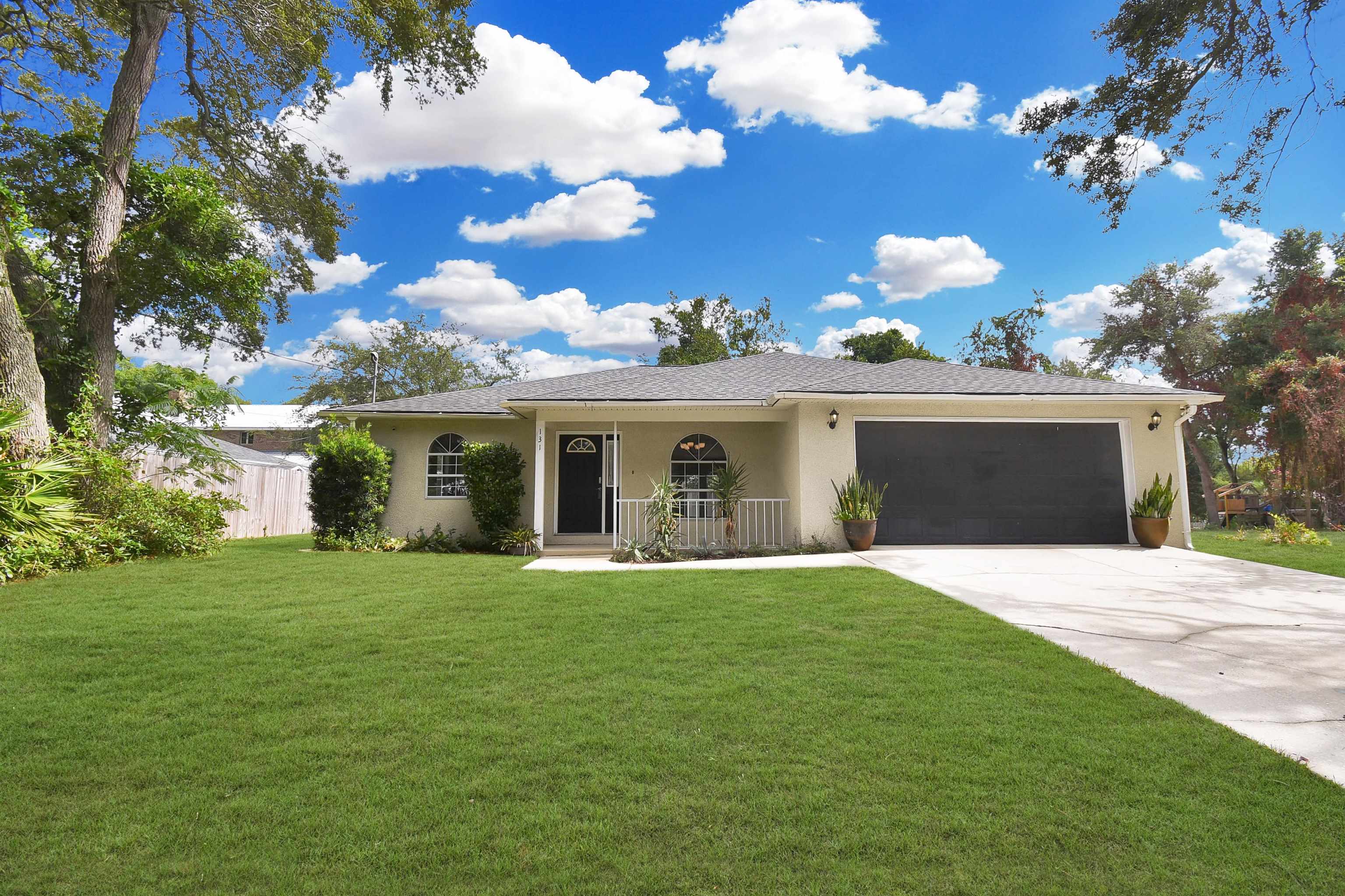 131 Osprey Road St. Augustine, FL 32086 - Photo 30 of 50 a front view of house with yard and green space
