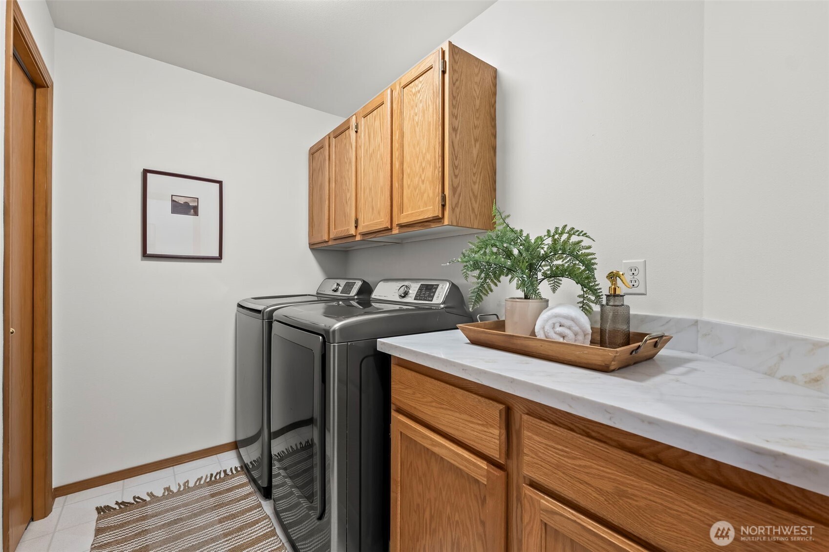 5203 53rd Street West University Place, WA 98467 - Photo 12 of 24 a kitchen with a sink and cabinets
