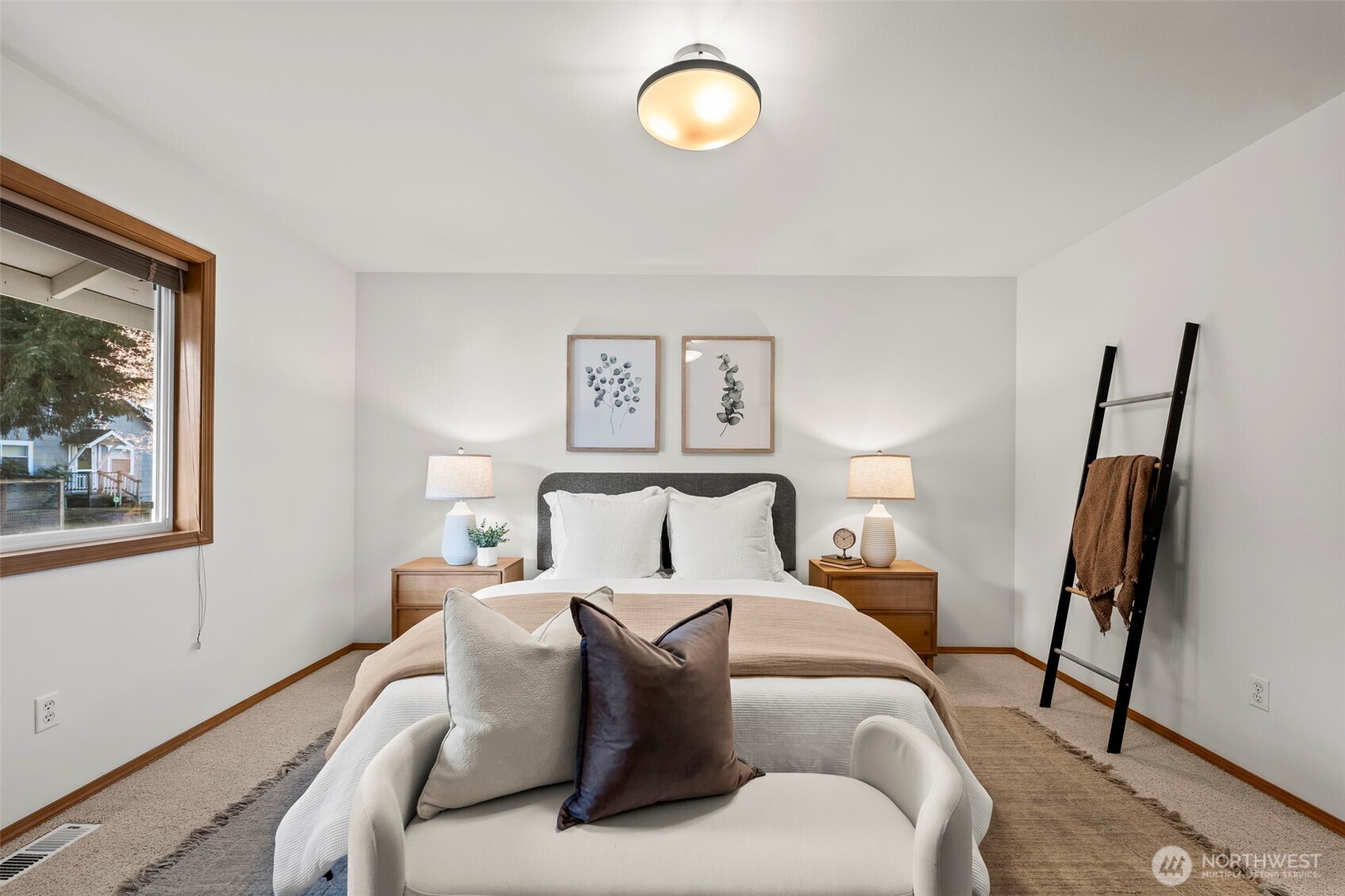 5203 53rd Street West University Place, WA 98467 - Photo 13 of 24 a bed room with a bed window and a mirror
