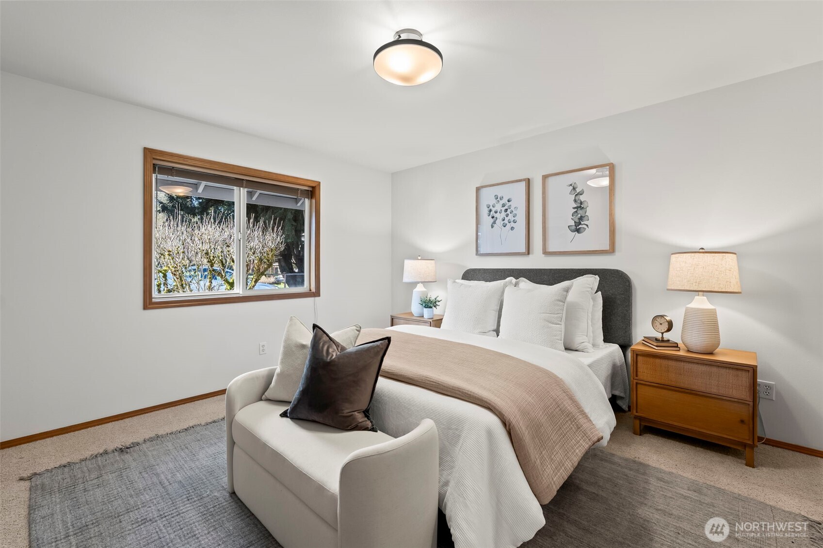 5203 53rd Street West University Place, WA 98467 - Photo 14 of 24 a bedroom with a bed and a lamp on table