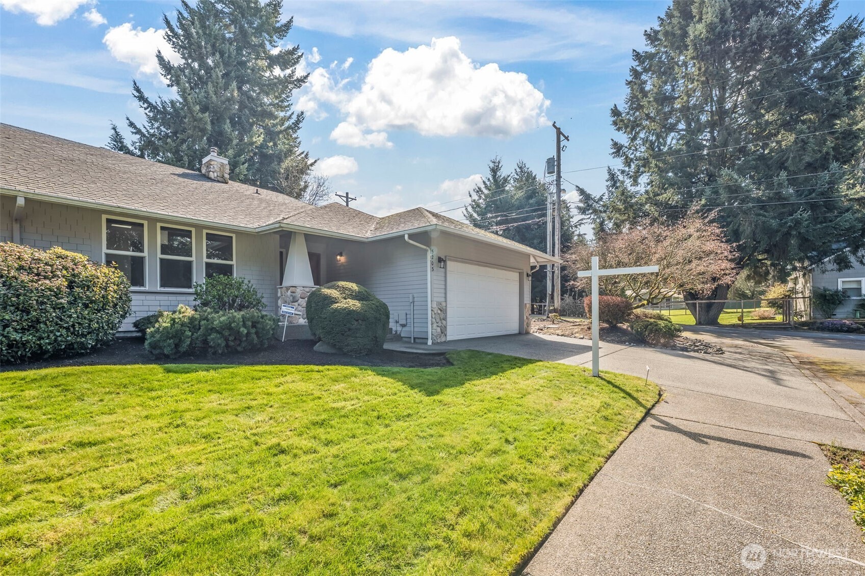 5203 53rd Street West University Place, WA 98467 - Photo 2 of 24 a view of a house with a yard and potted plants