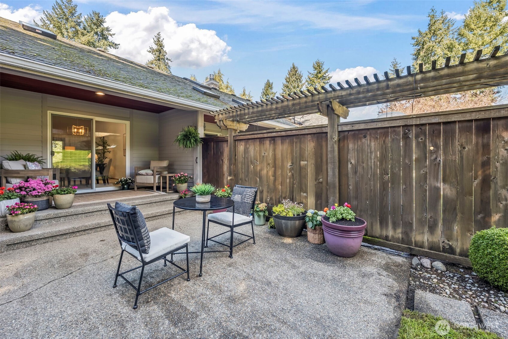5203 53rd Street West University Place, WA 98467 - Photo 21 of 24 a view of a patio with table and chairs and potted plants