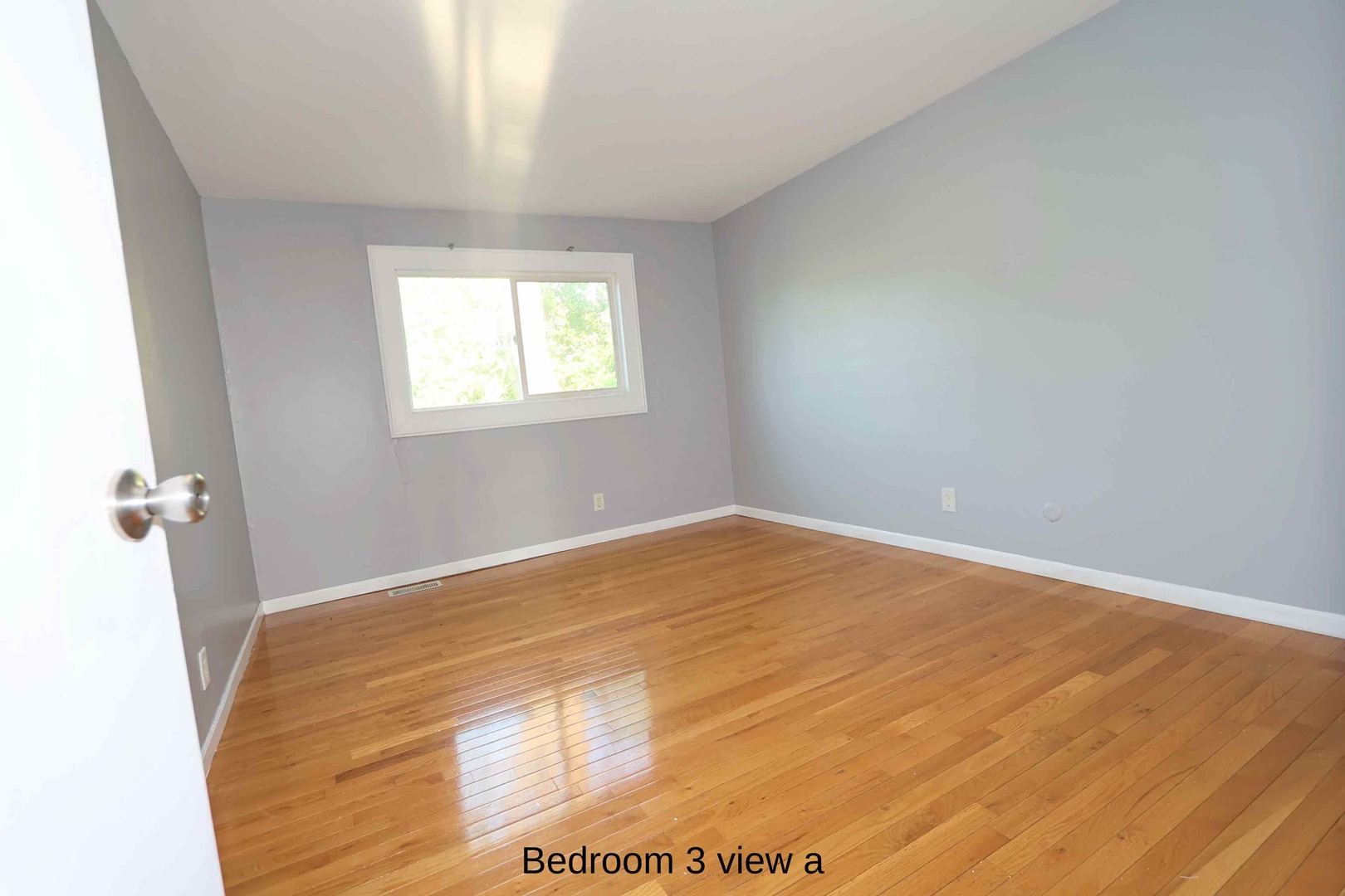 427 Mallview Lane, Unit 427 Bolingbrook, IL 60440 - Photo 9 of 16 a view of empty room with wooden floor