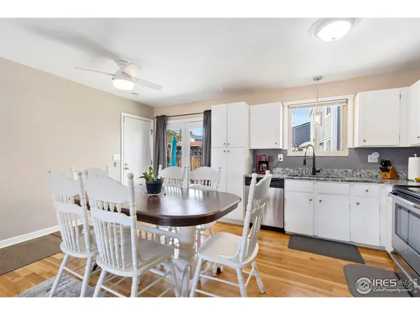 a kitchen with a dining table and chairs