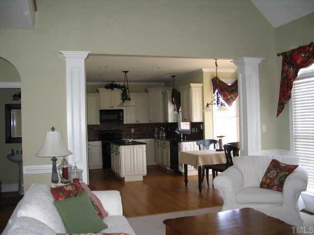 4517 Deer Stream Lane Raleigh, NC 27603 - Photo 8 of 11 a living room with furniture and a wooden floor
