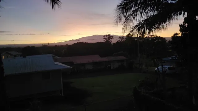 a view of a backyard with sitting area