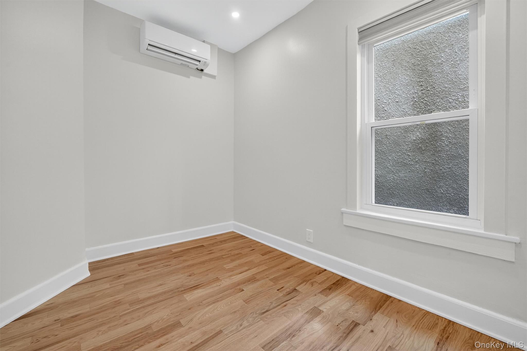 79 Main Street, Unit 2E Ossining, NY 10562 - Photo 14 of 20 a view of a small space with wooden floor and a window