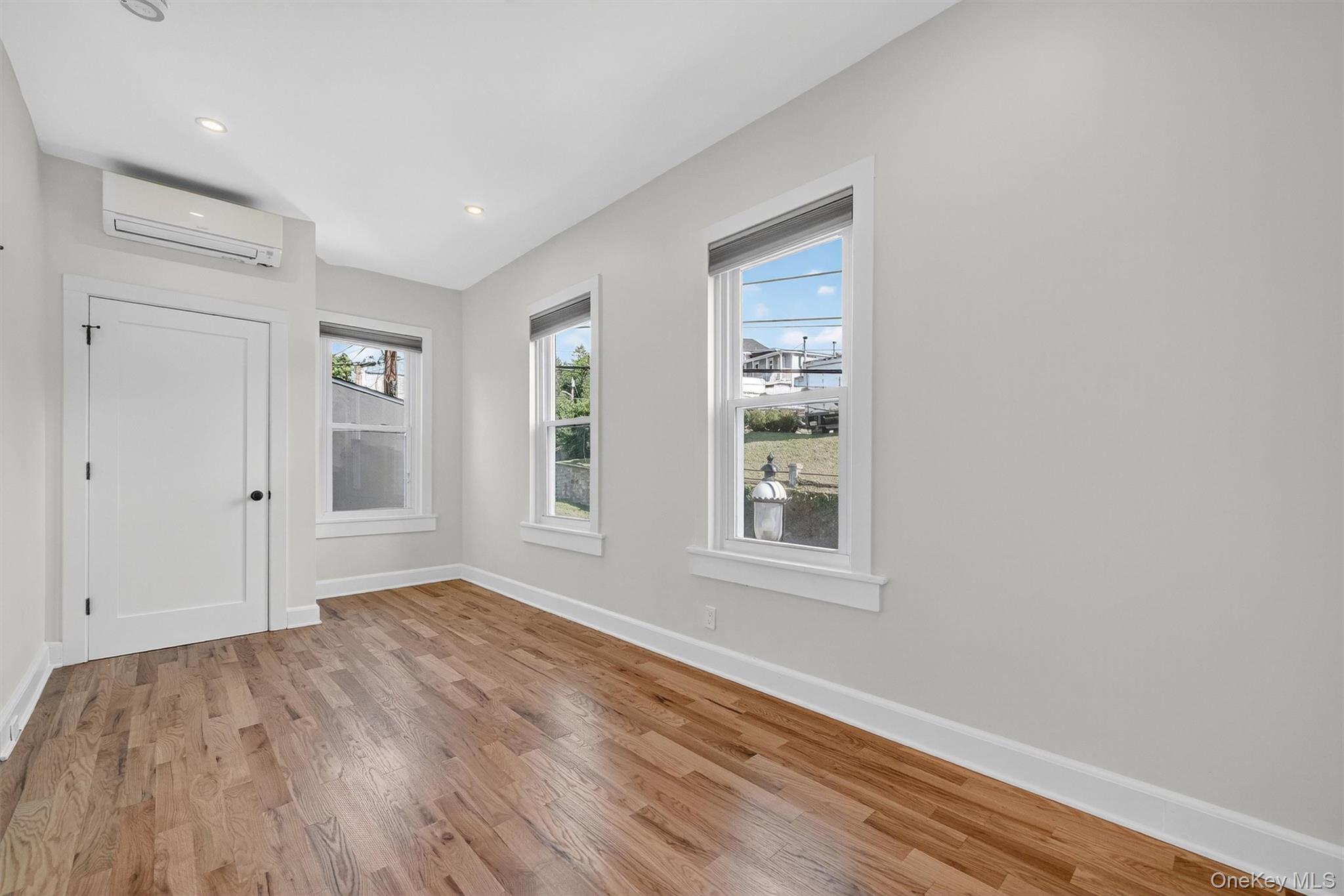 79 Main Street, Unit 2E Ossining, NY 10562 - Photo 15 of 20 a view of an empty room with wooden floor and a window