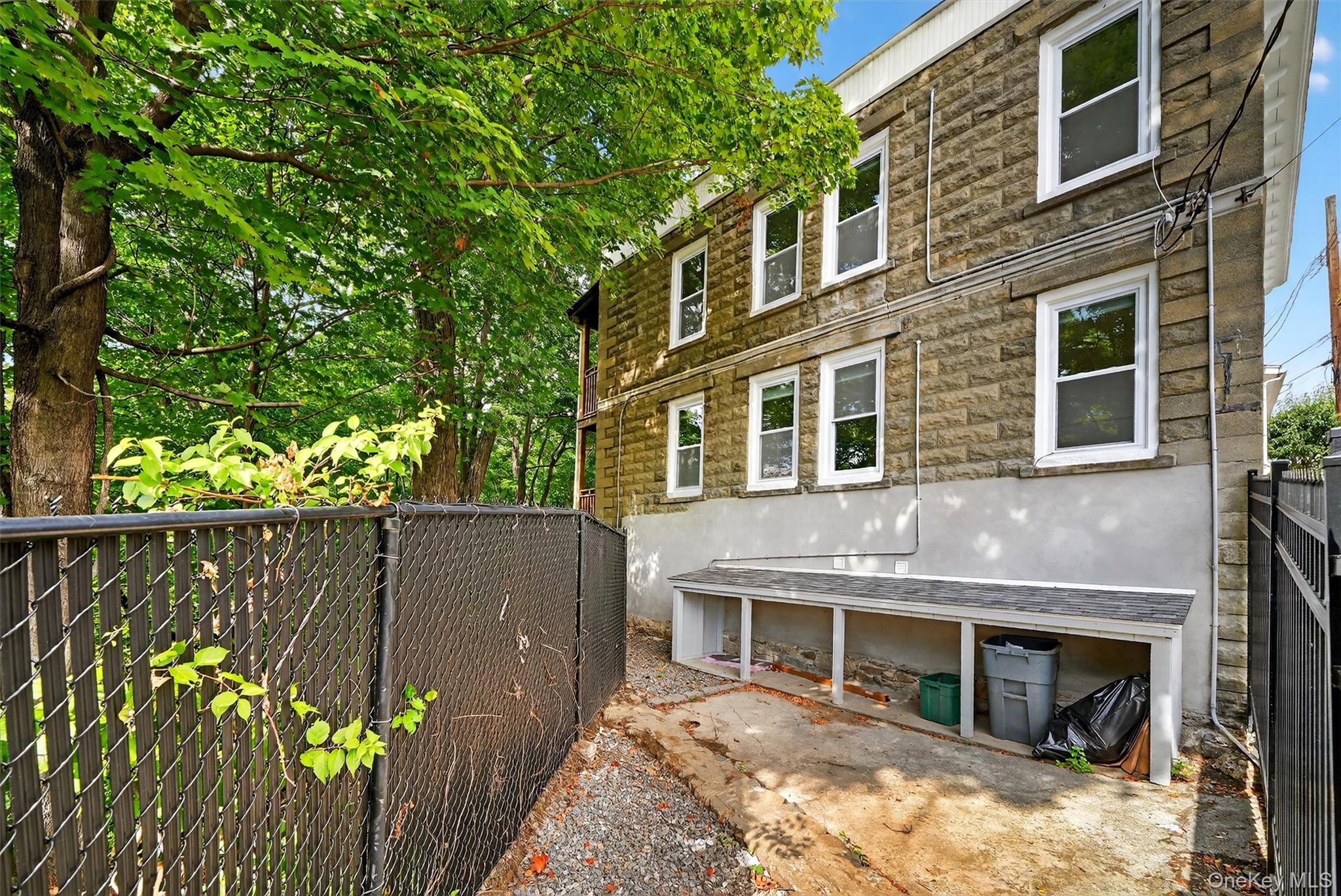 79 Main Street, Unit 2E Ossining, NY 10562 - Photo 19 of 20 a front view of a house with a garden
