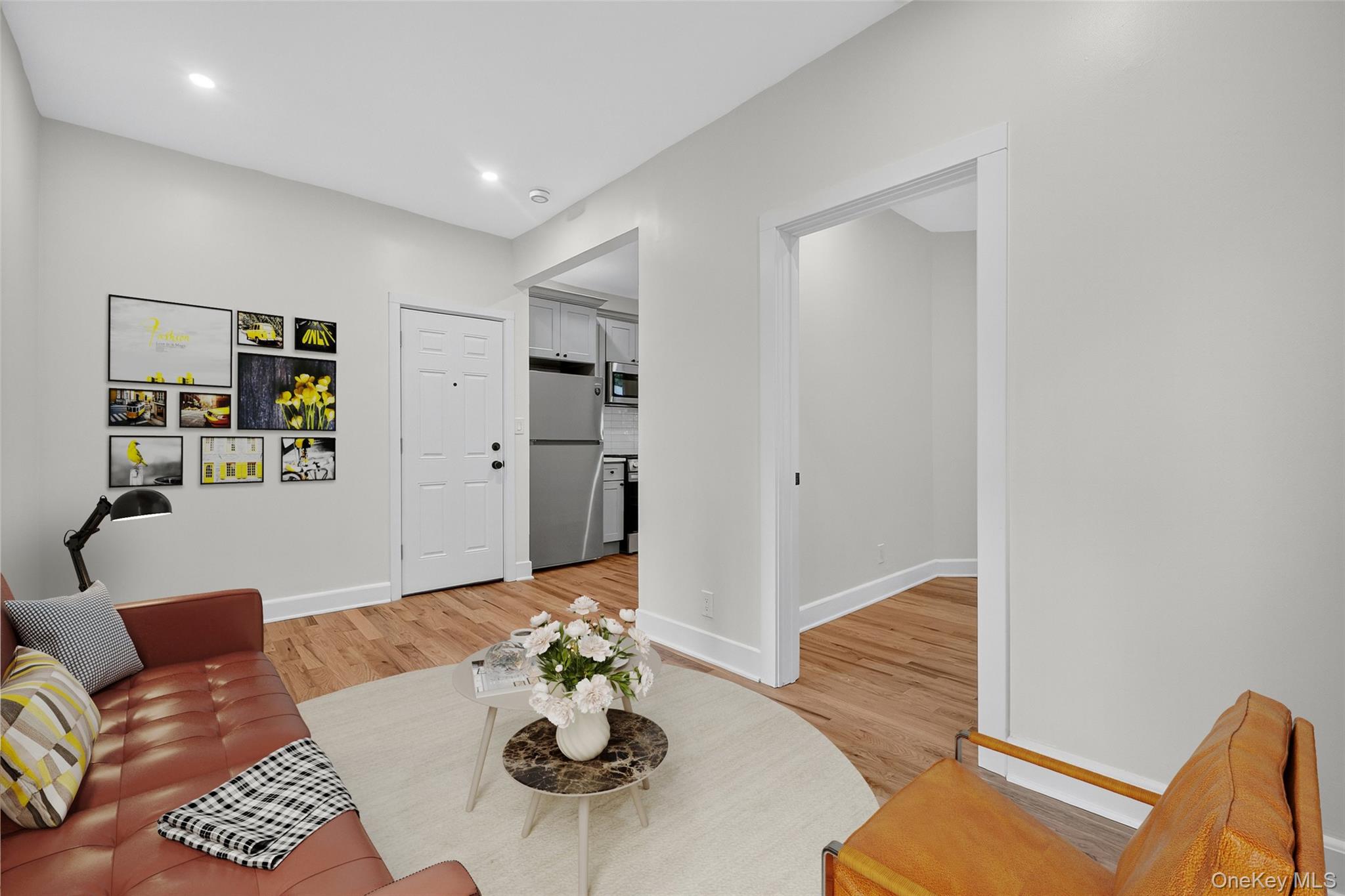 79 Main Street, Unit 2E Ossining, NY 10562 - Photo 4 of 20 a living room with furniture and wooden floor