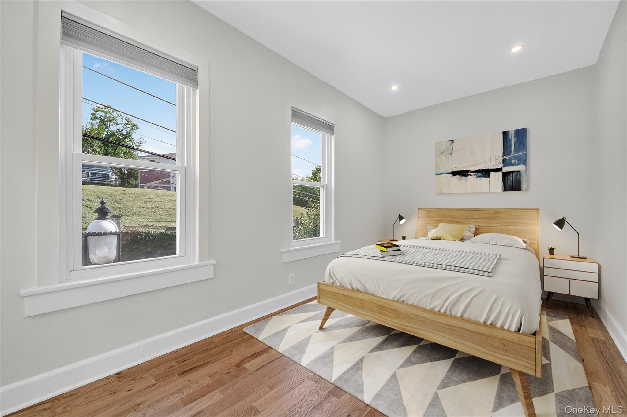 79 Main Street, Unit 2E Ossining, NY 10562 - Photo 5 of 20 a bedroom with a bed and a window