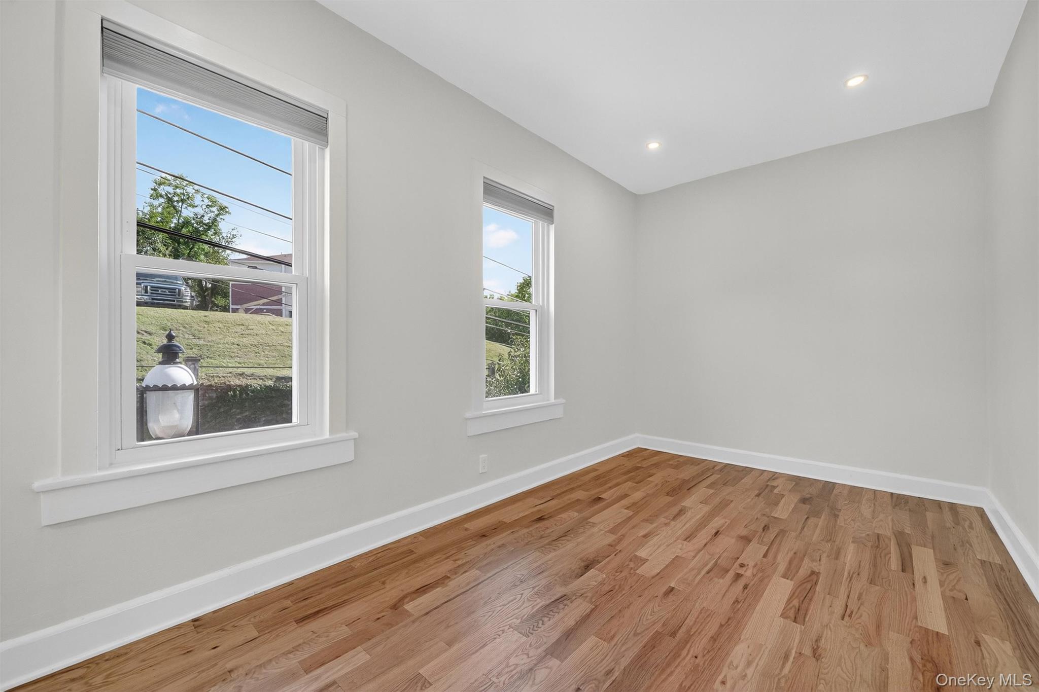 79 Main Street, Unit 2E Ossining, NY 10562 - Photo 6 of 20 a view of empty room with wooden floor and fan