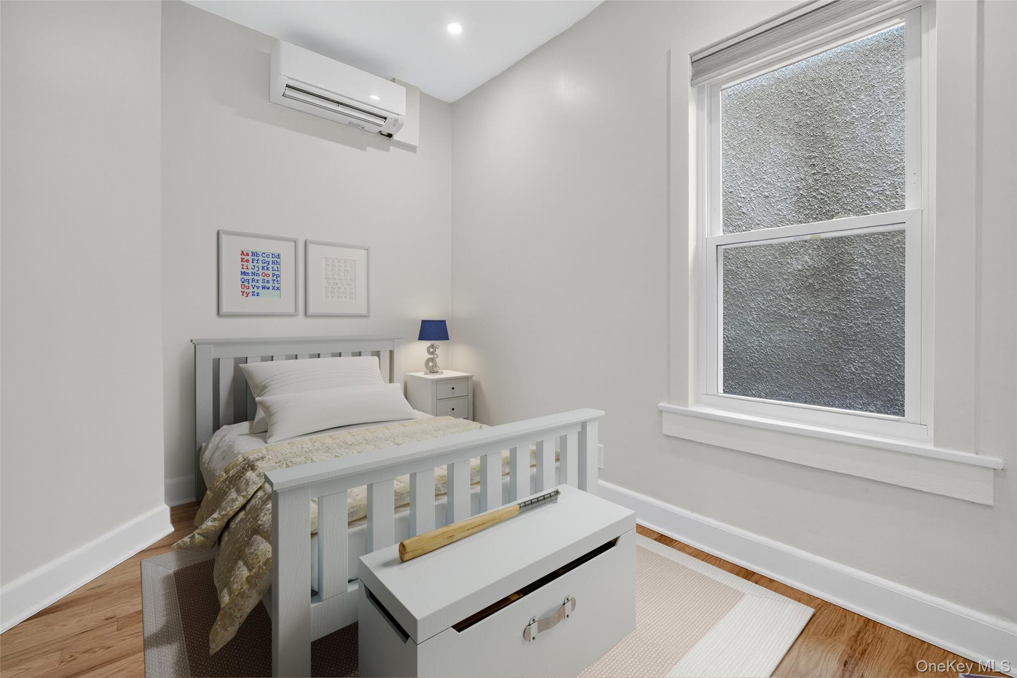 79 Main Street, Unit 2E Ossining, NY 10562 - Photo 7 of 20 a bedroom with a bed and a window