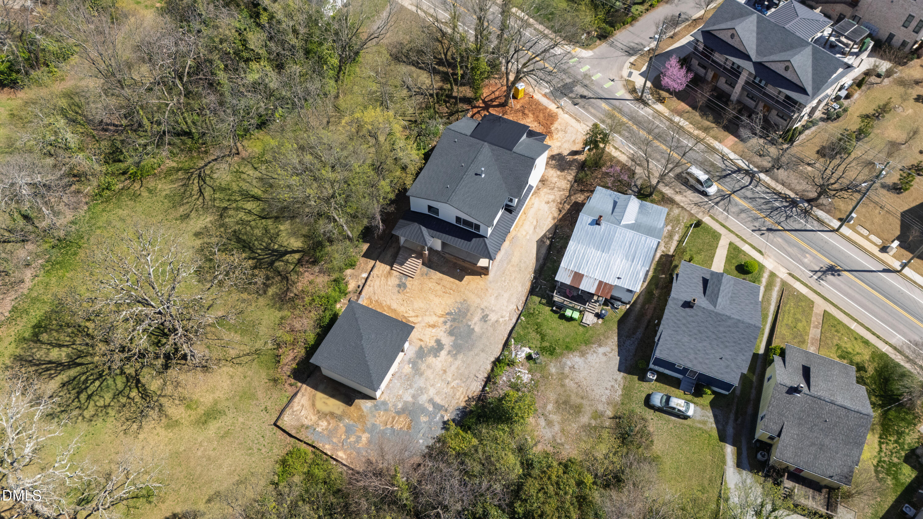 909 Oberlin Road Raleigh, NC 27605 - Photo 50 of 59 an aerial view of a house with a yard and lake view