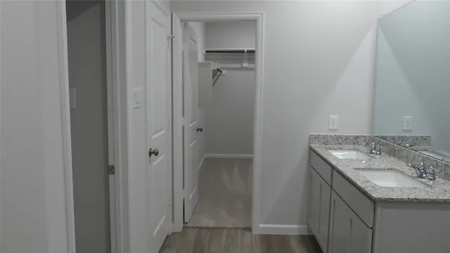 a bathroom with a glass shower door