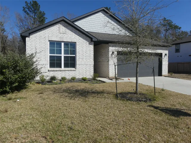 a house view with a backyard space