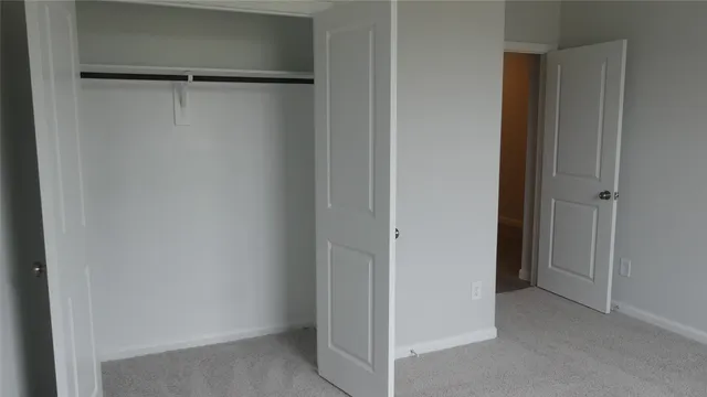 a kitchen with stainless steel appliances granite countertop a stove top oven a sink and a refrigerator