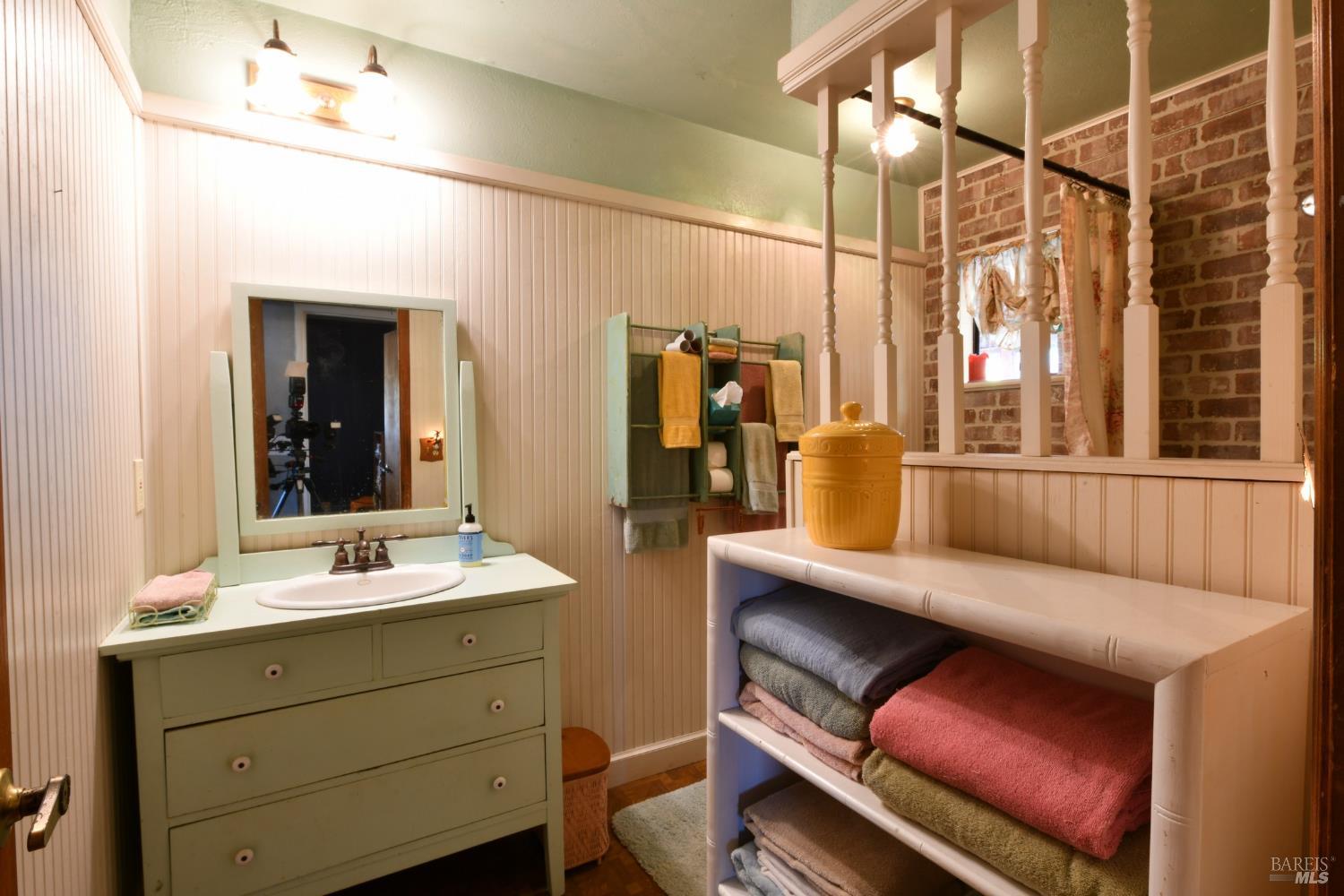 148 Millbrae Avenue Santa Rosa, CA 95407 - Photo 18 of 29 a bathroom with a sink and a mirror