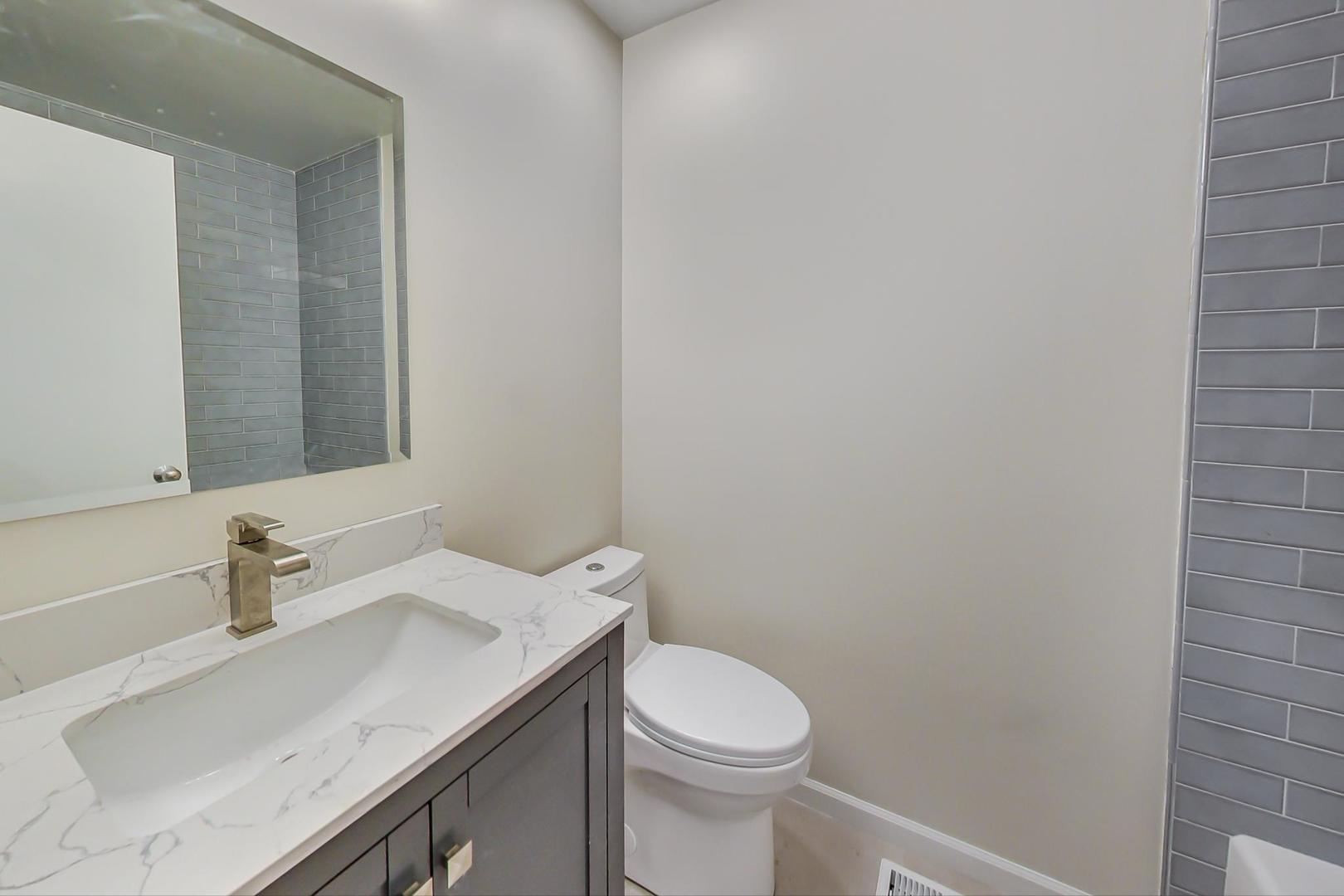 20 West 15th Street, Unit B Chicago, IL 60605 - Photo 13 of 21 a bathroom with a sink and a toilet