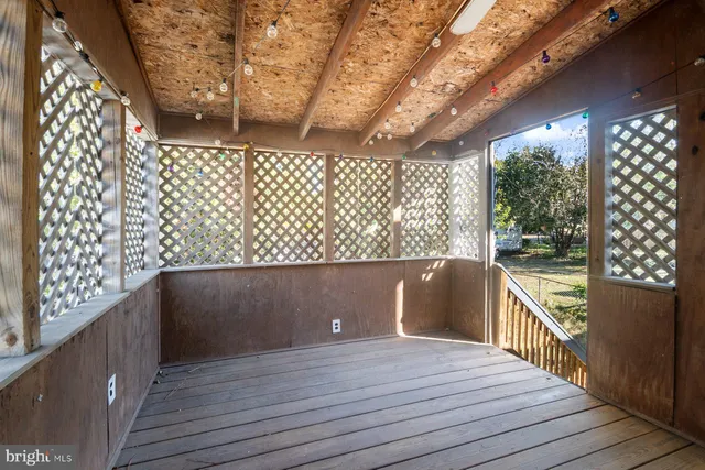 a view of balcony with wooden floor