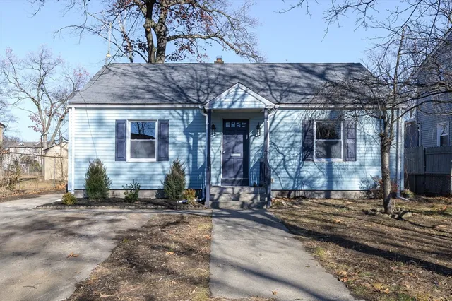 a front view of a house with stairs