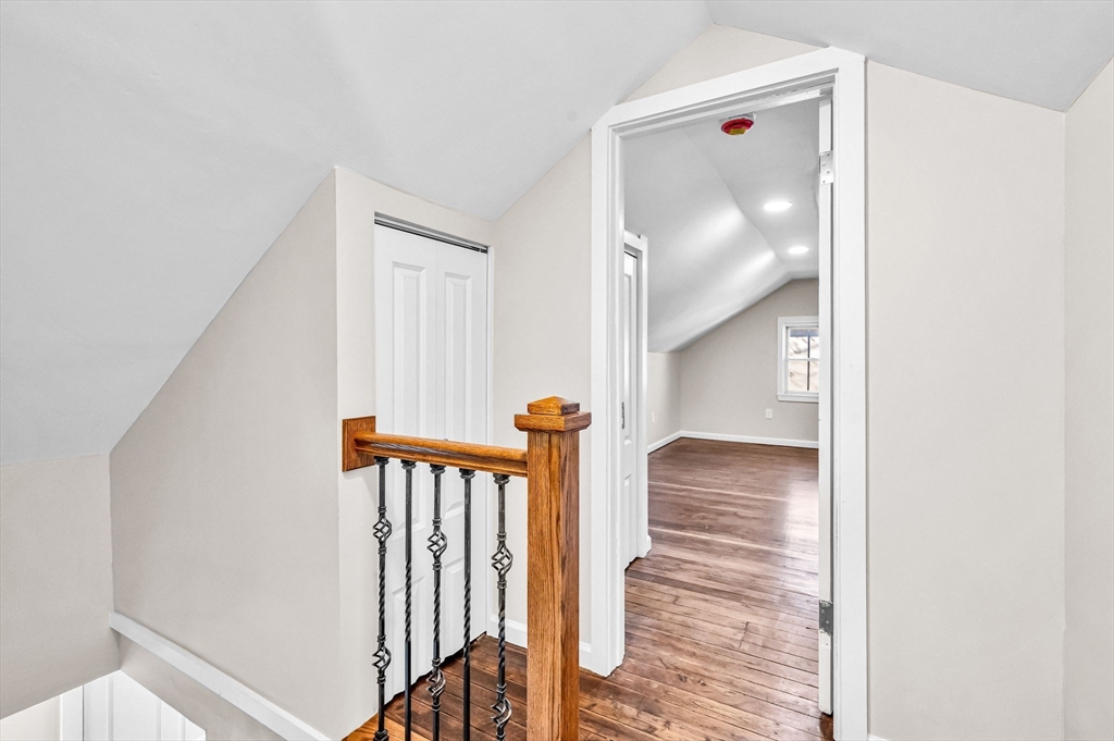 97 Parallel Street Springfield, MA 01104 - Photo 21 of 42 a view of a hallway with a door and stairs