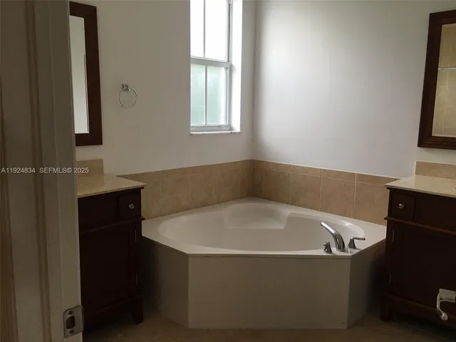 a bathroom with a bathtub and a toilet