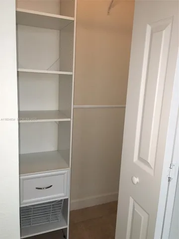 a view of an empty room and stairs