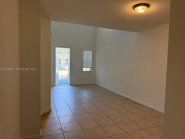 a view of an empty room and window
