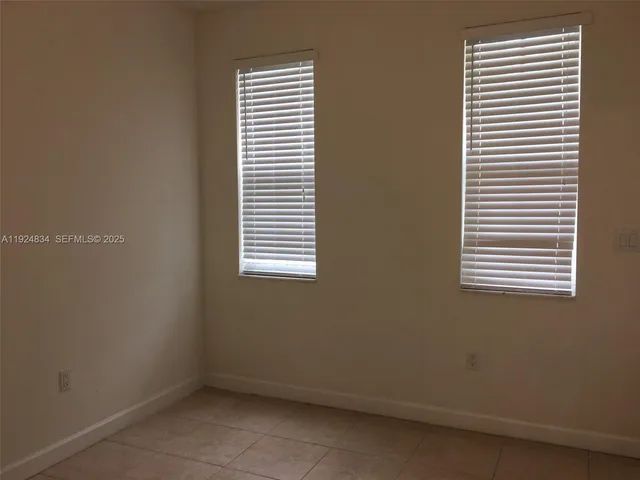 a view of a room that has a window in it
