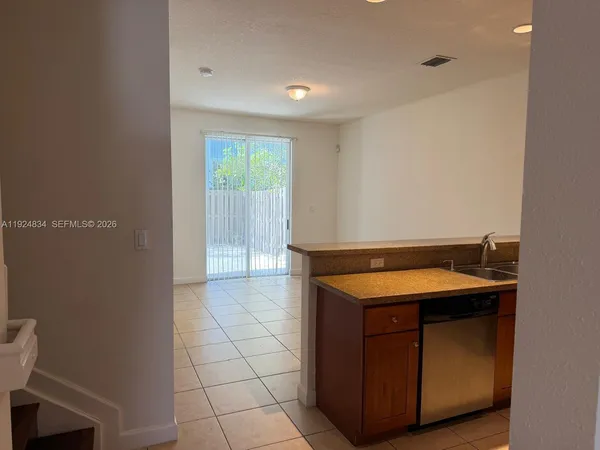 a room with a sink and a mirror