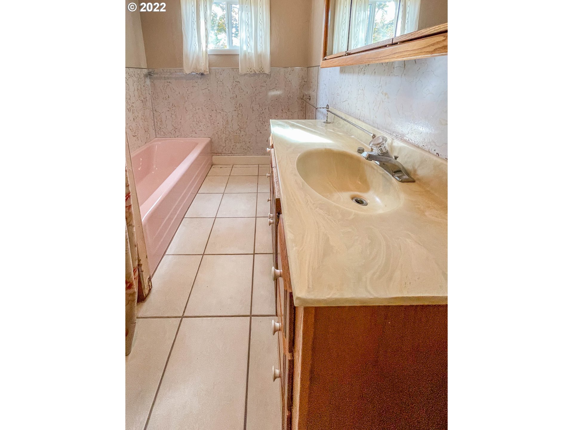 695 Lone Rock Road Glide, OR 97443 - Photo 15 of 48 a bathroom with a sink and a mirror