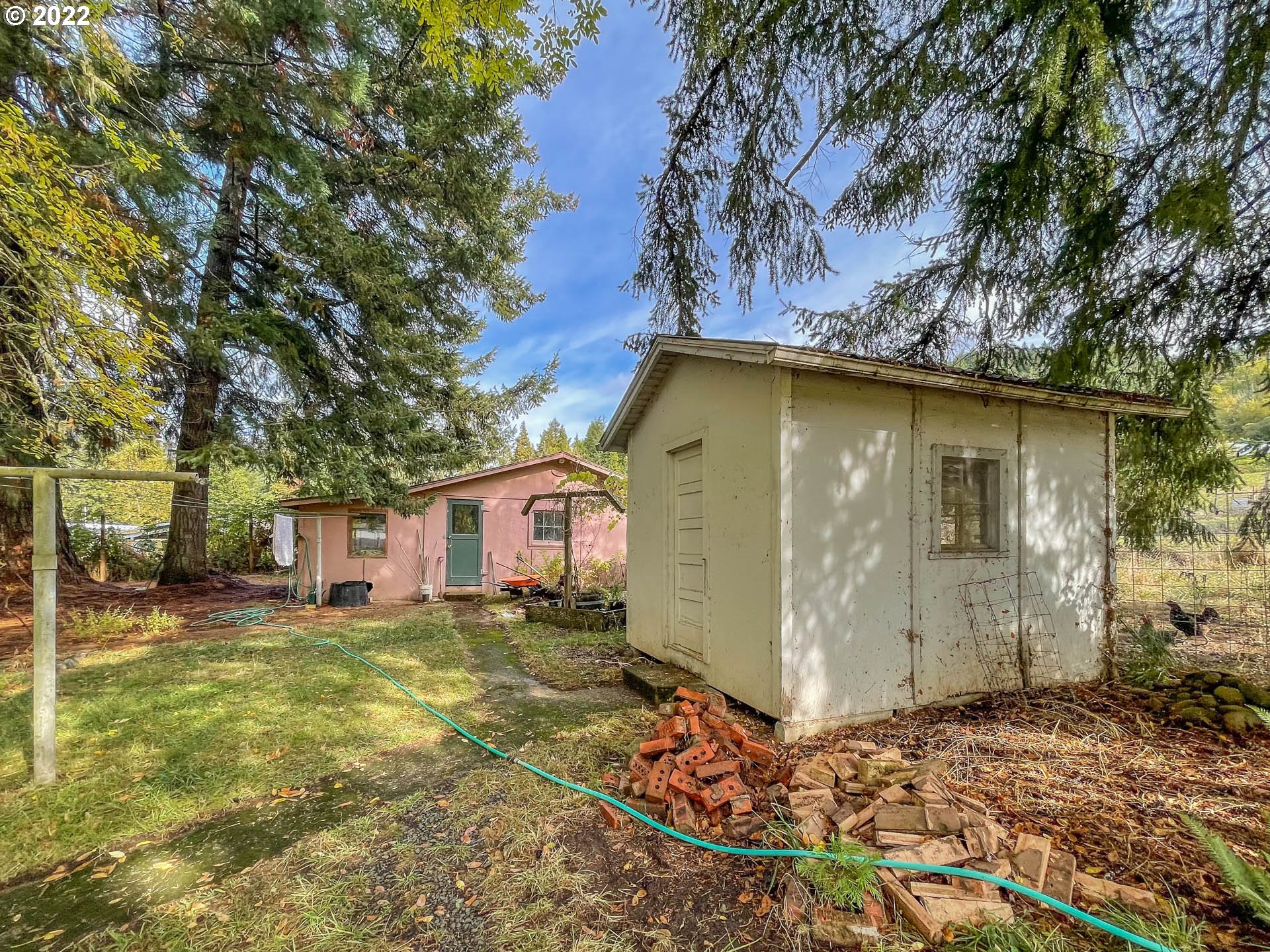 695 Lone Rock Road Glide, OR 97443 - Photo 18 of 48 a front view of a house with a yard