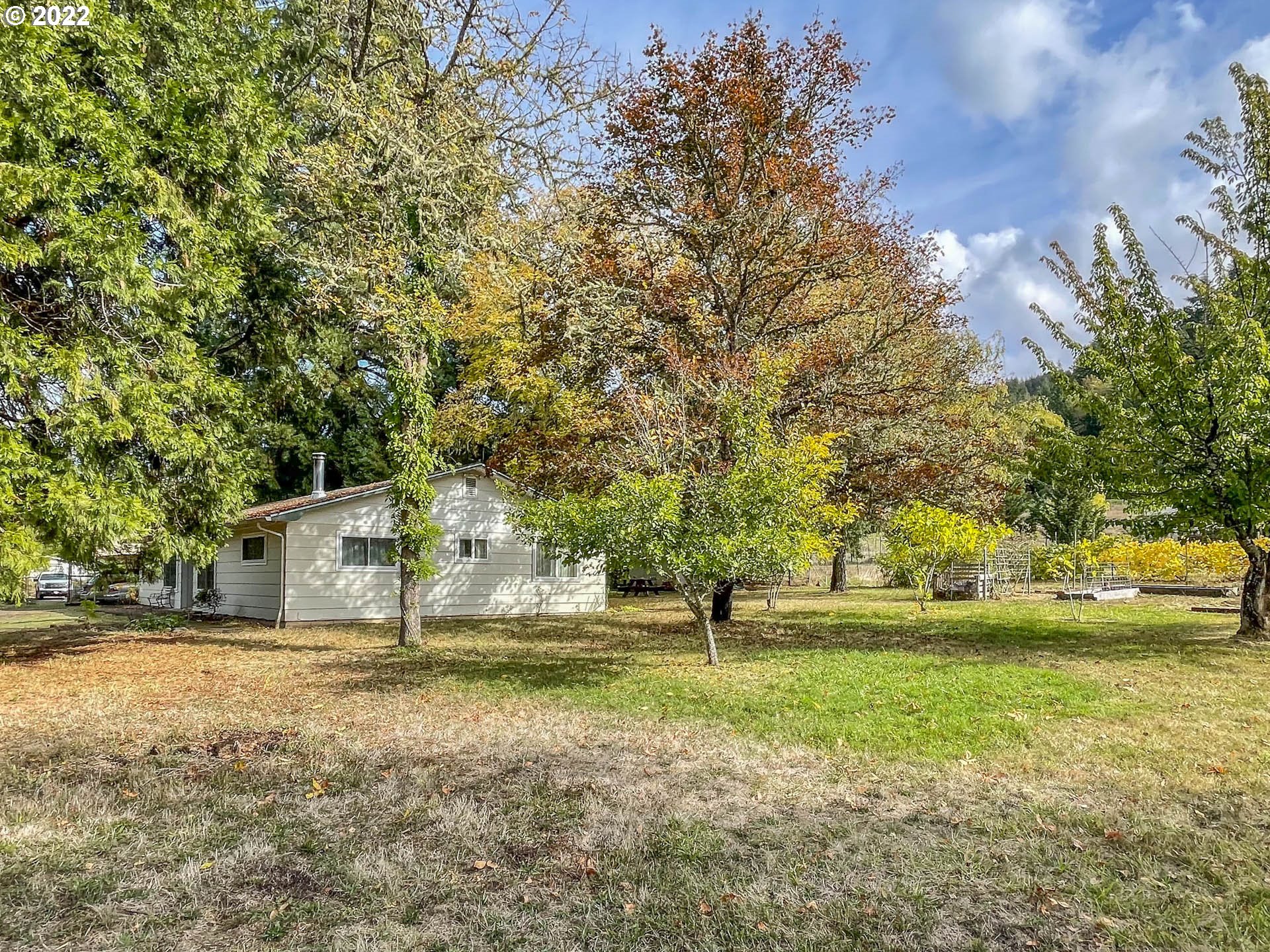 695 Lone Rock Road Glide, OR 97443 - Photo 20 of 48 a view of a house with a yard