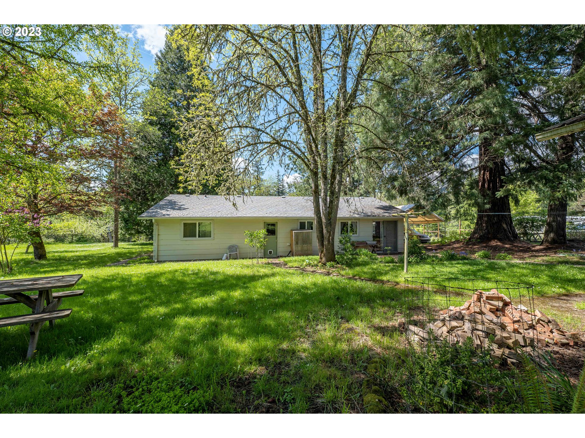 695 Lone Rock Road Glide, OR 97443 - Photo 25 of 48 a house view with a garden space